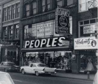 black and white photo of people's storefront