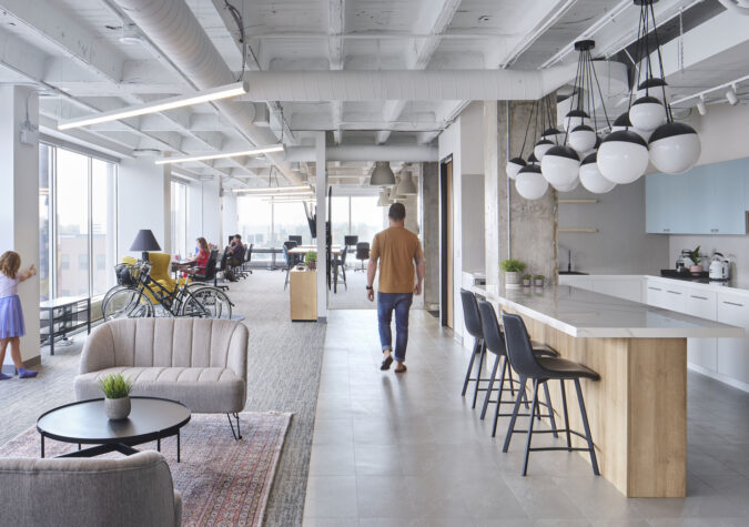 sunny open concept office with people working